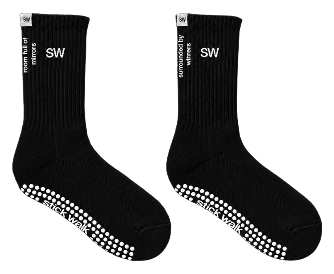Stick Walk grip crew sock in black — SW cuff mark, side slogans, white silicone grip sole