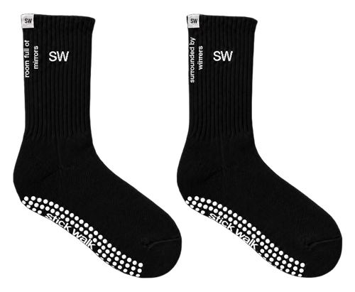Stick Walk grip crew sock in black — SW cuff mark, side slogans, white silicone grip sole